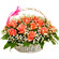 basket of coral roses with babys breath. Haiti